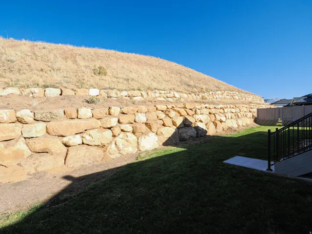 Terraced rock retaining walls provide structural landscaping