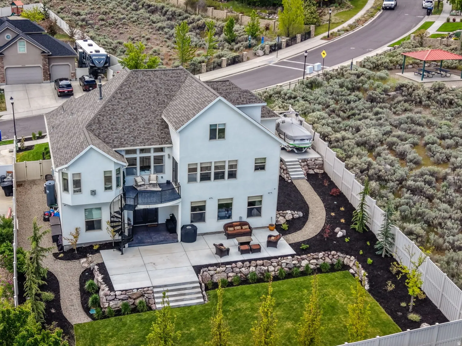 Contemporary stucco residence featuring multiple levels of outdoor living
