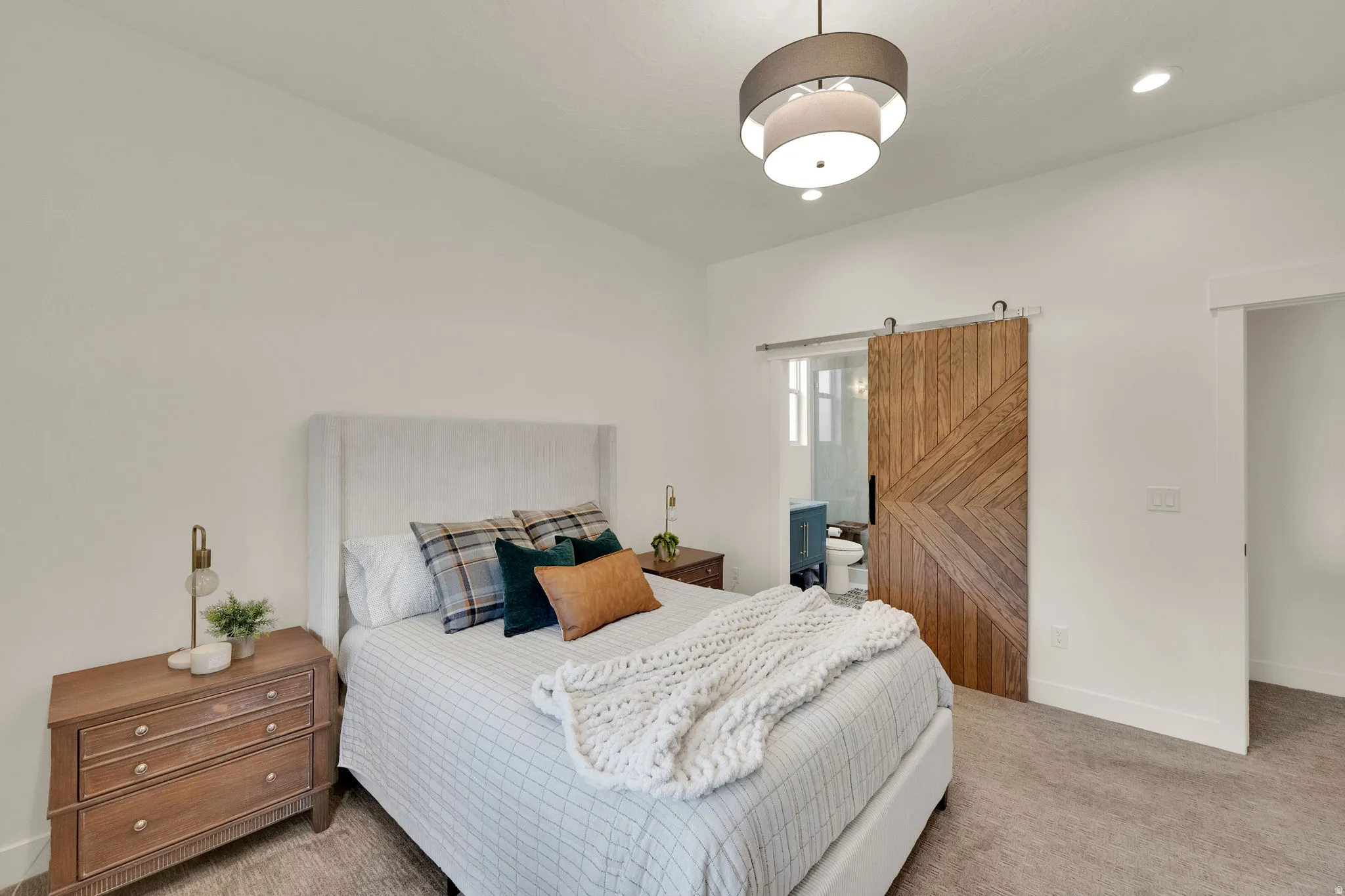 Bedroom featuring light-colored walls and carpet flooring