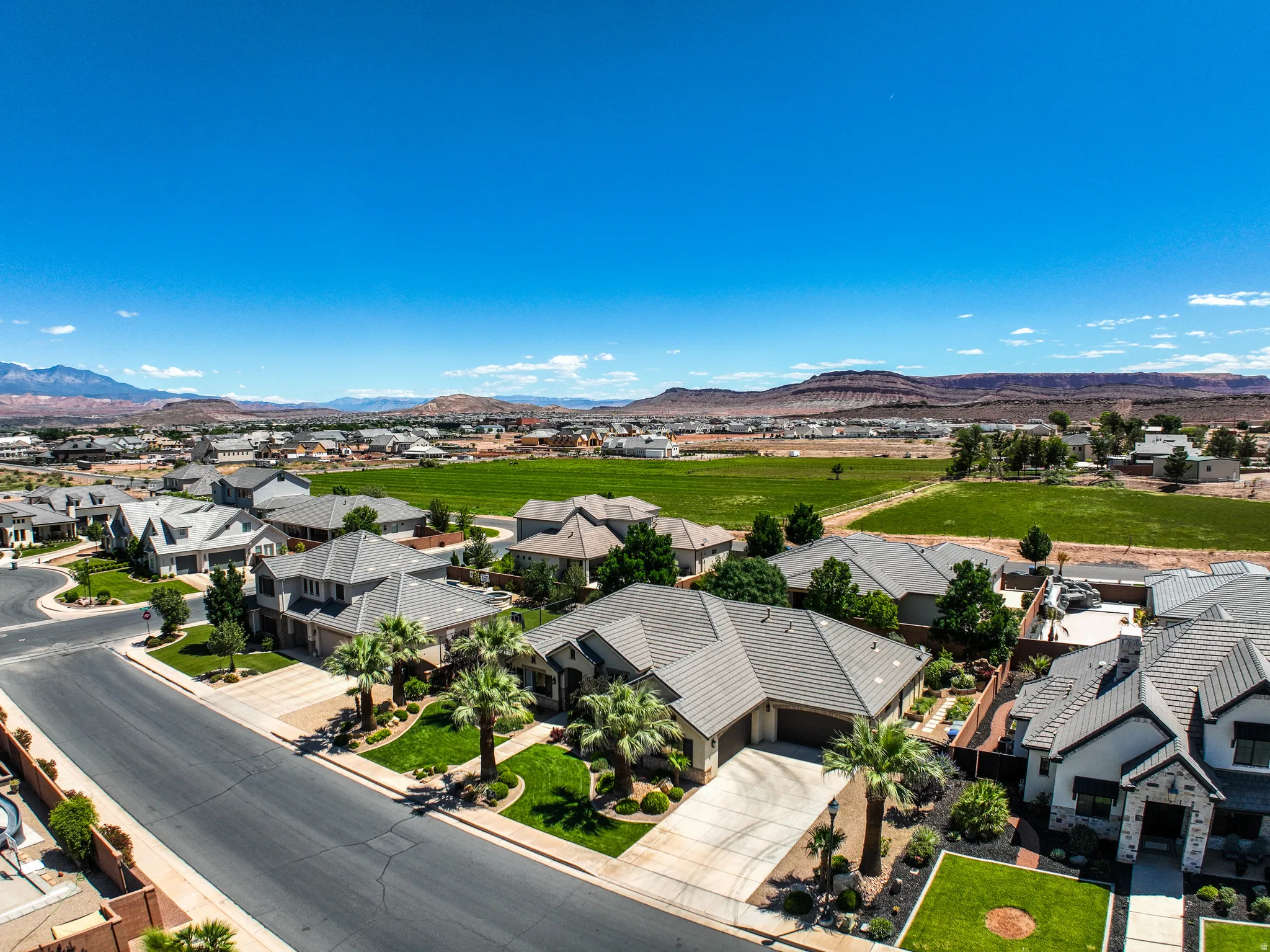 Residential neighborhood featuring paved streets, mature landscaping, and diverse home designs