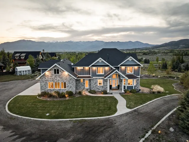 Contemporary residence featuring a combination of stone and siding facade