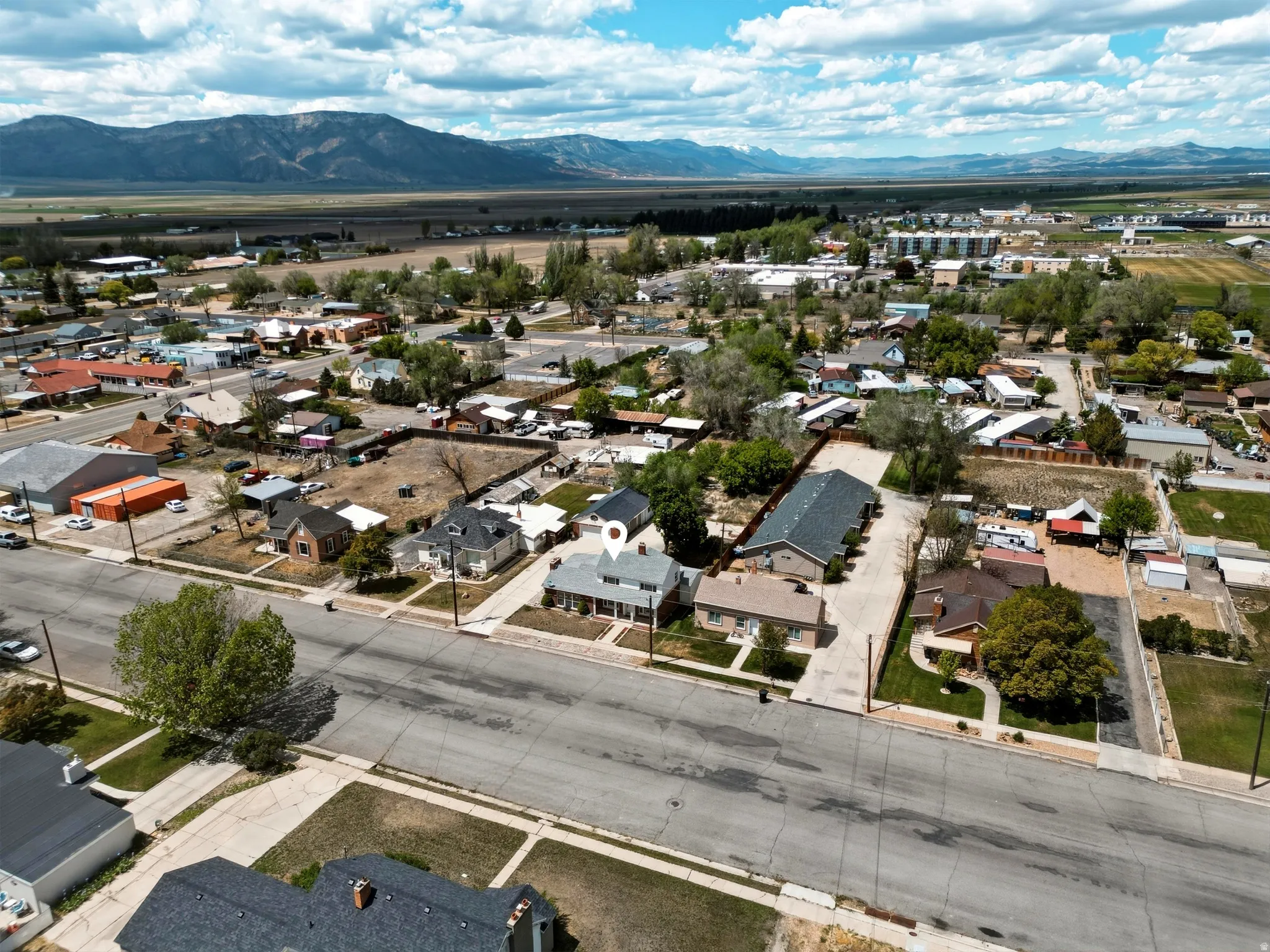 Aerial perspective showcasing a community with varied architectural styles and established streetscapes