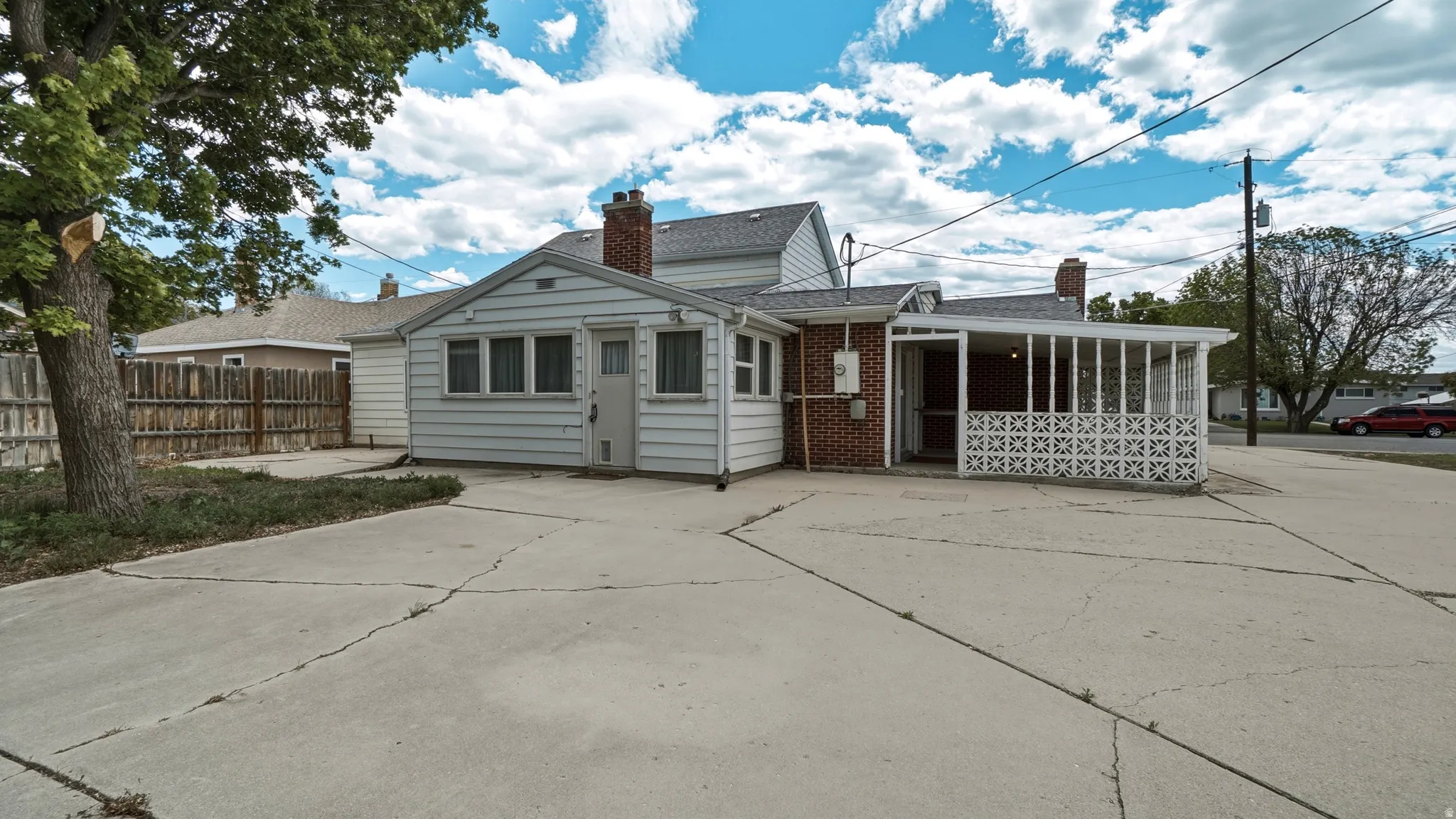 Expansive concrete driveway providing ample off-street parking
