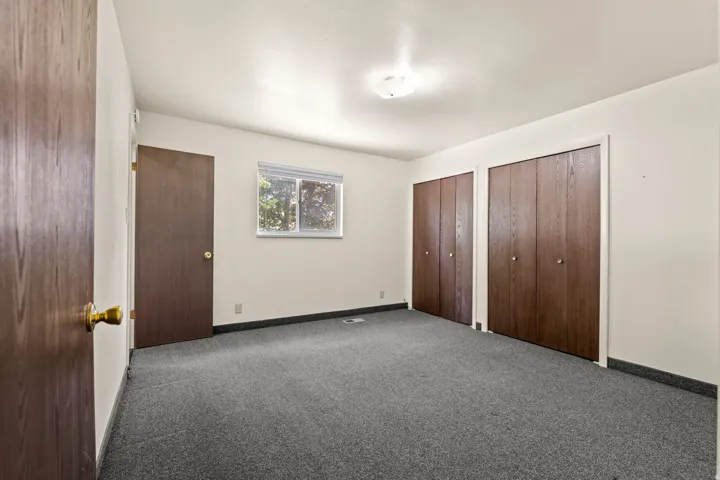 Room featuring grey carpet flooring and white painted walls