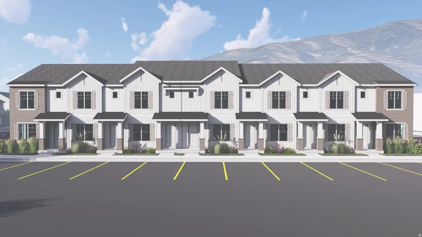 Row of townhomes featuring light-colored vertical siding and dark shingled roofs