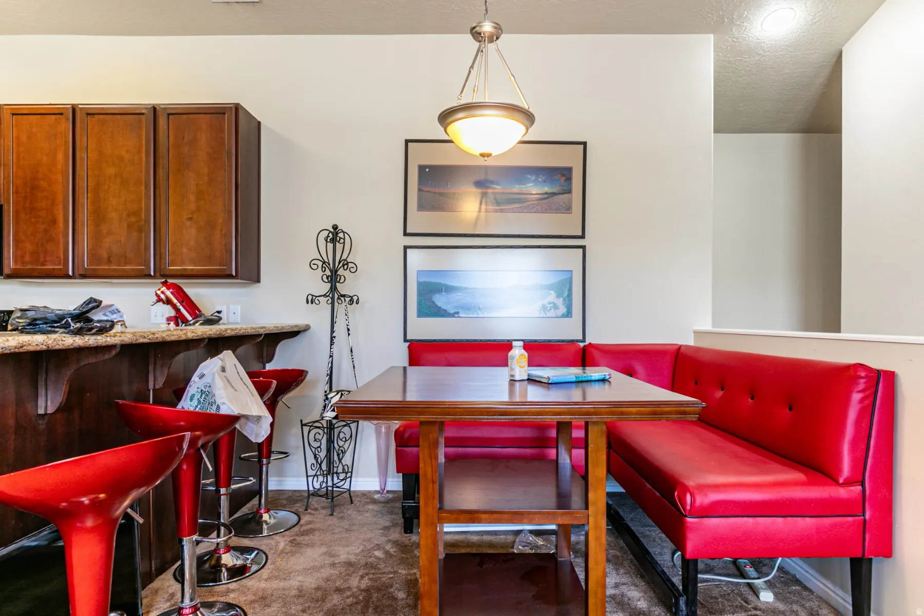Breakfast nook featuring a built-in banquette with upholstered seating