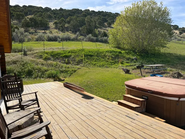 Expansive outdoor deck featuring natural wood planks