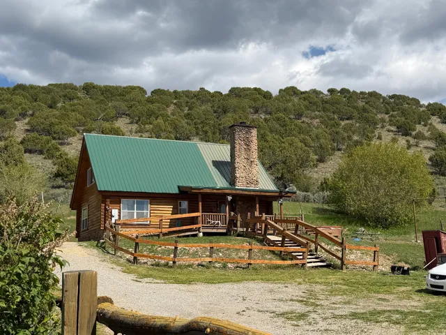 Log cabin residence in Laketown Utah on 12 acres