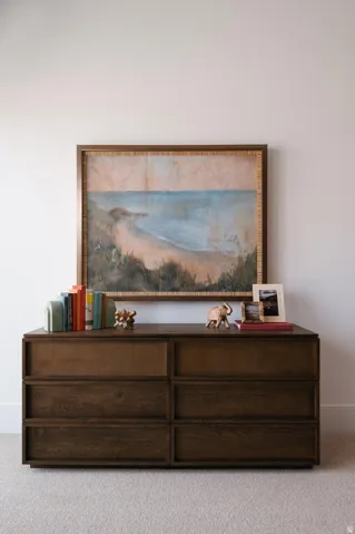 Plush neutral carpeting extends throughout this space
