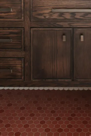Dark wood cabinetry with multiple drawers and double-door storage