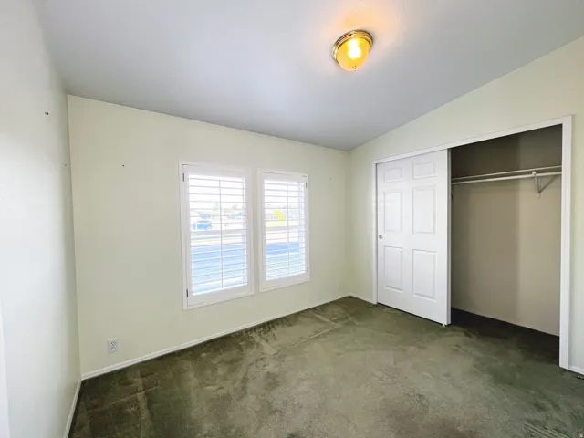 Light-toned walls with contrasting dark carpeting