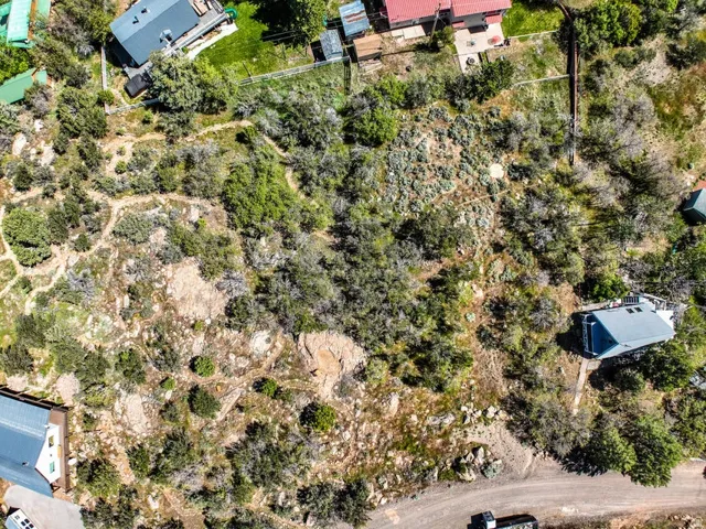 Expansive undeveloped land featuring natural rock outcroppings and abundant native vegetation