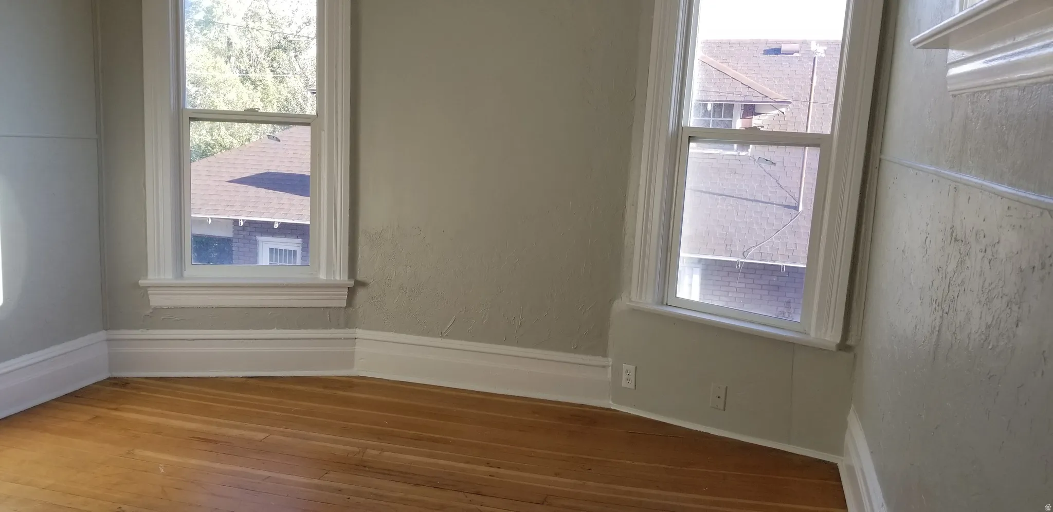 Hardwood flooring complements light-toned walls