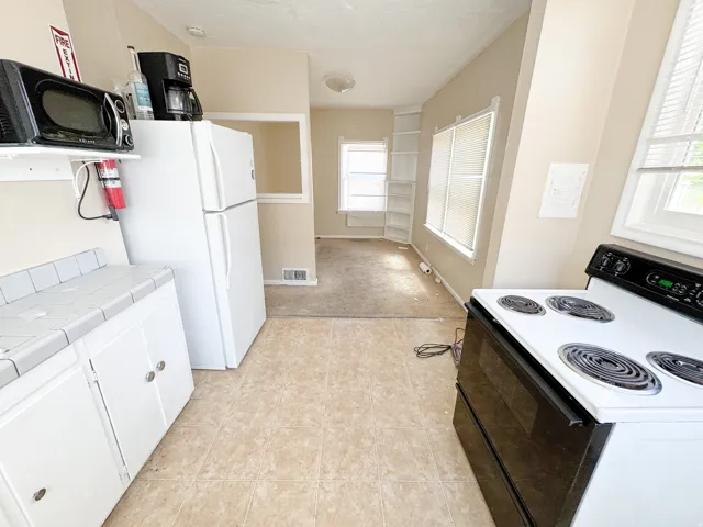 Kitchen area featuring tiled flooring