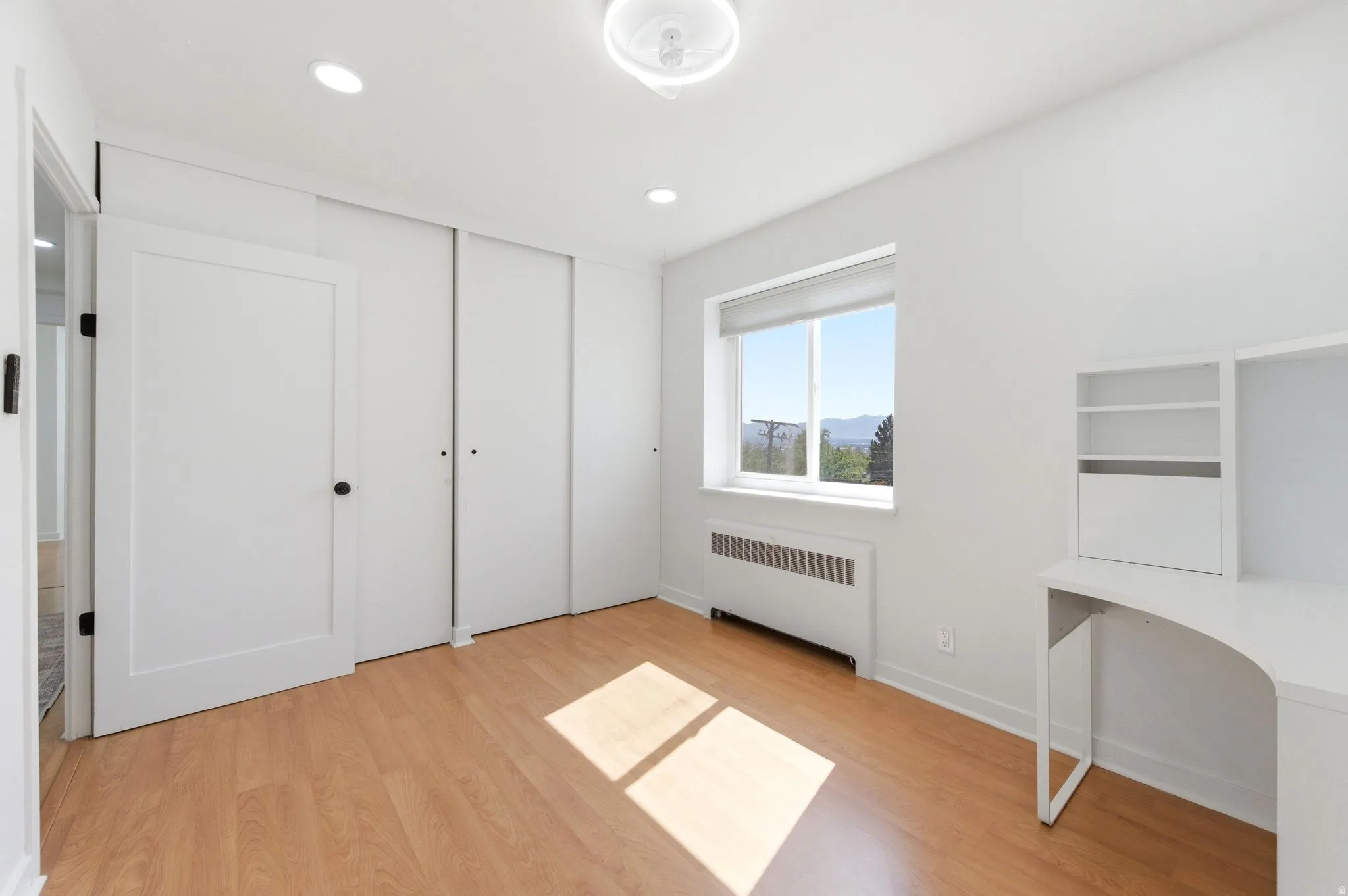 Bedroom 1 has double closets, and west facing window