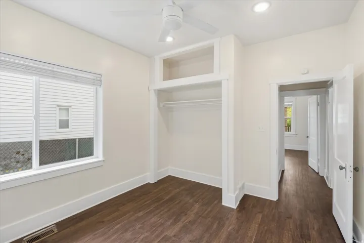 Bedroom featuring wood-finish flooring, recessed lighting, and a ceiling fan