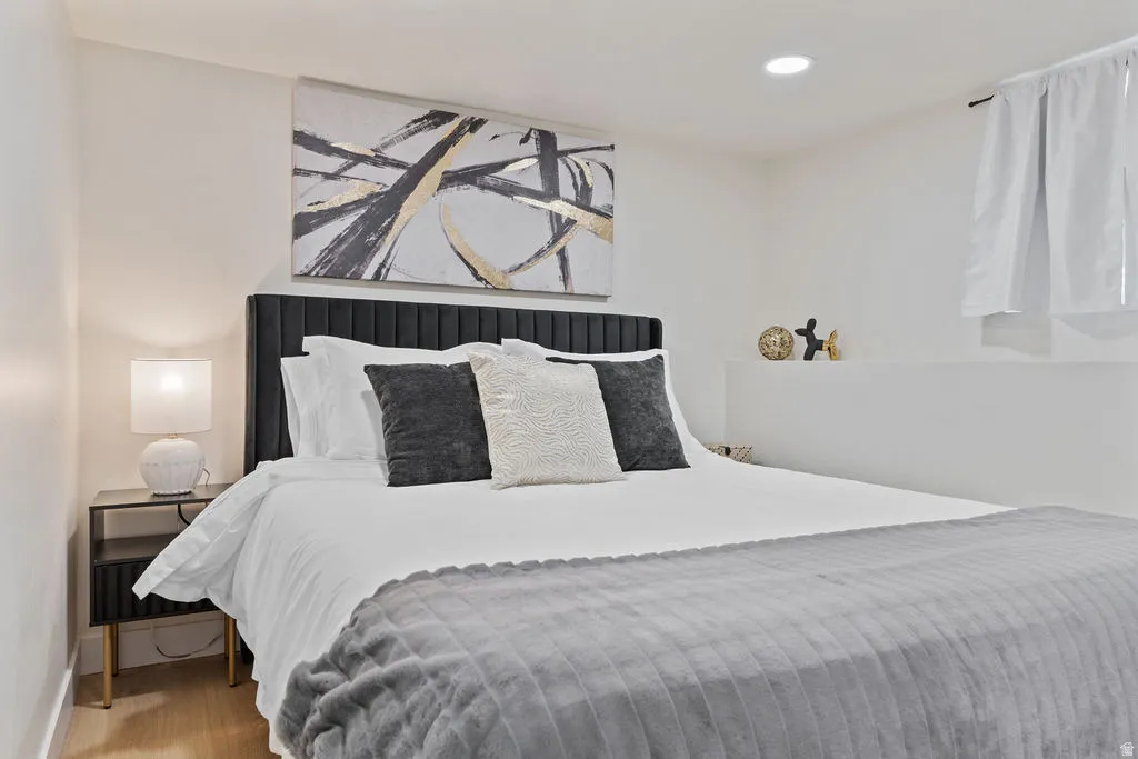 Bedroom featuring light wood-finish flooring and recessed lighting