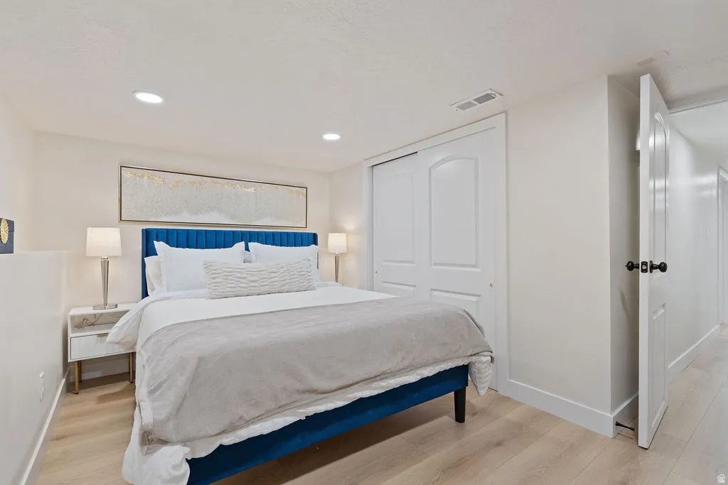 Recessed lighting illuminating light wood-finish flooring
