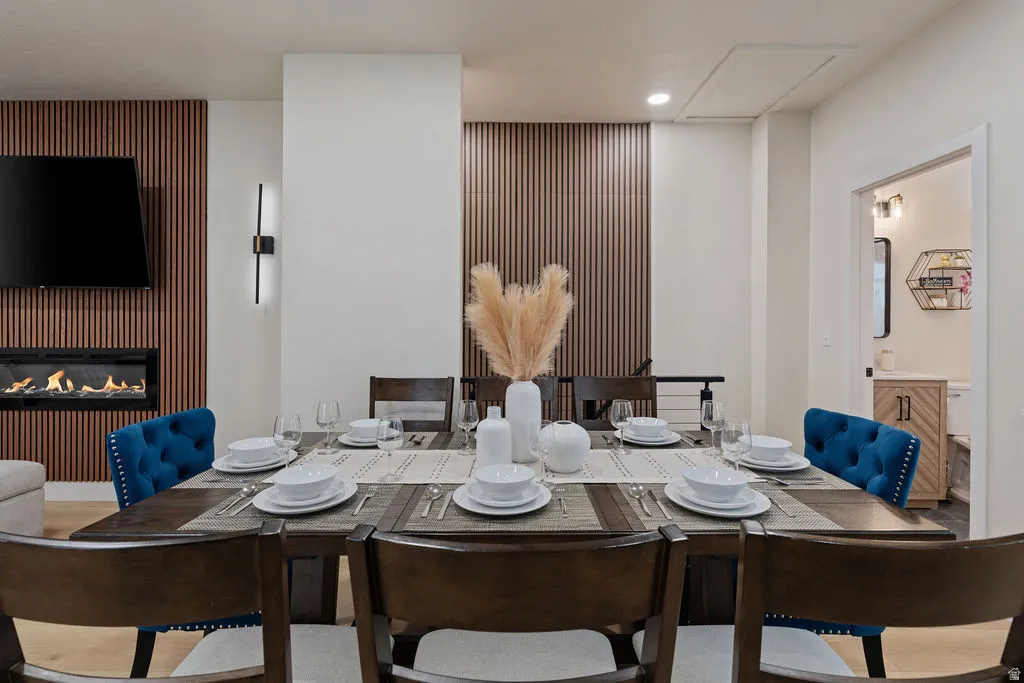 Dining area featuring a dark wood-finish dining table and wood-finish dining chairs
