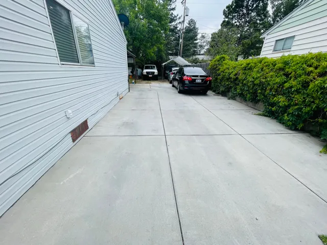 Long concrete driveway with a durable surface