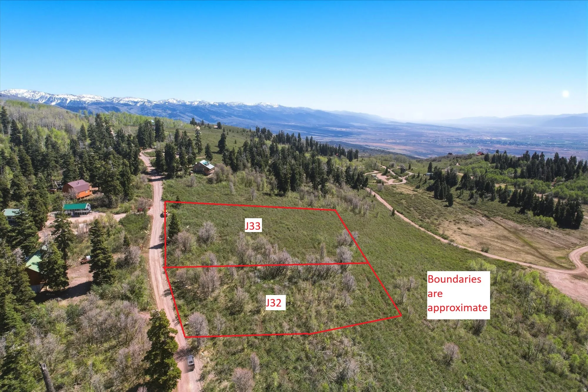 Expansive, undeveloped mountain property featuring natural vegetation and a distant valley
