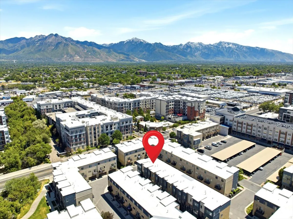 Modern multi-story residential buildings in an urban setting with distinct architectural designs