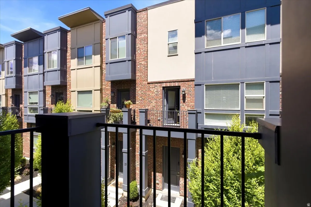 Contemporary multi-story facade featuring brick and paneling