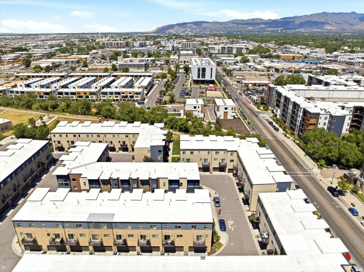 Modern multi-story residential buildings featuring balconies and flat roofs