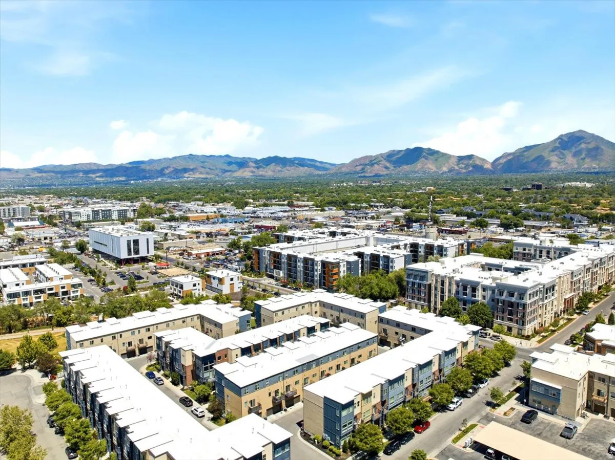 Expansive urban landscape featuring contemporary multi-story buildings and townhome developments