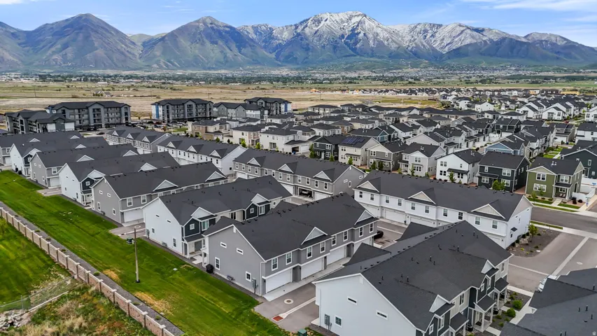 Extensive residential development with a backdrop of snow-capped mountains
