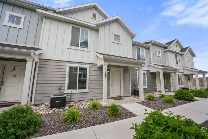 Modern townhome exterior with board and batten and horizontal siding
