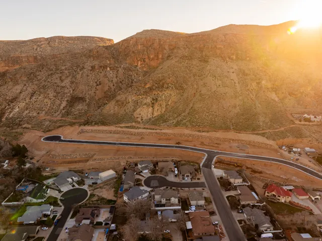 Expansive mountain backdrop with new road infrastructure