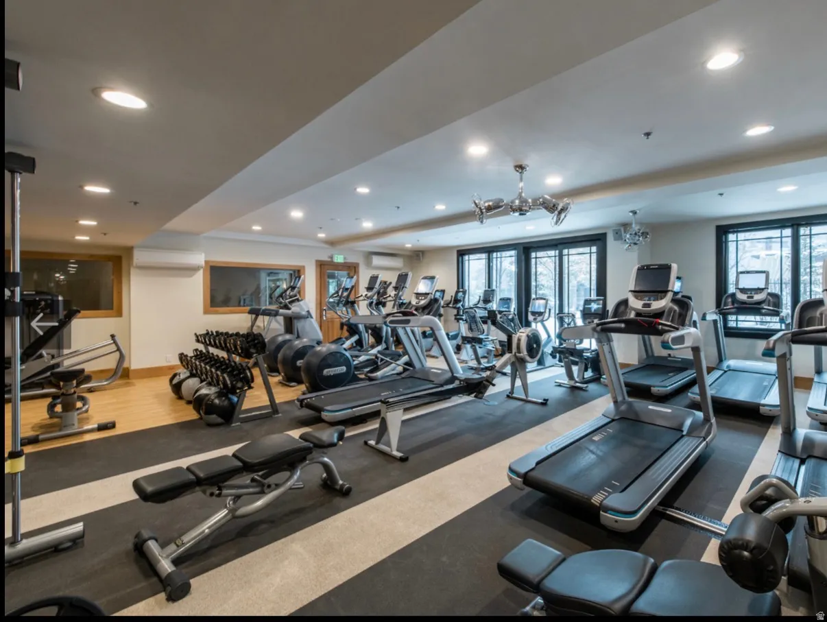 Fitness center featuring a variety of cardio and strength training equipment
