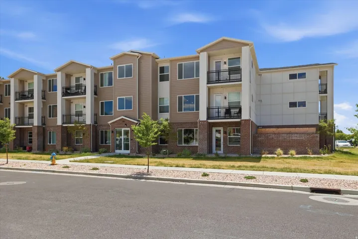 Multi-story apartment building with a brick and siding exterior