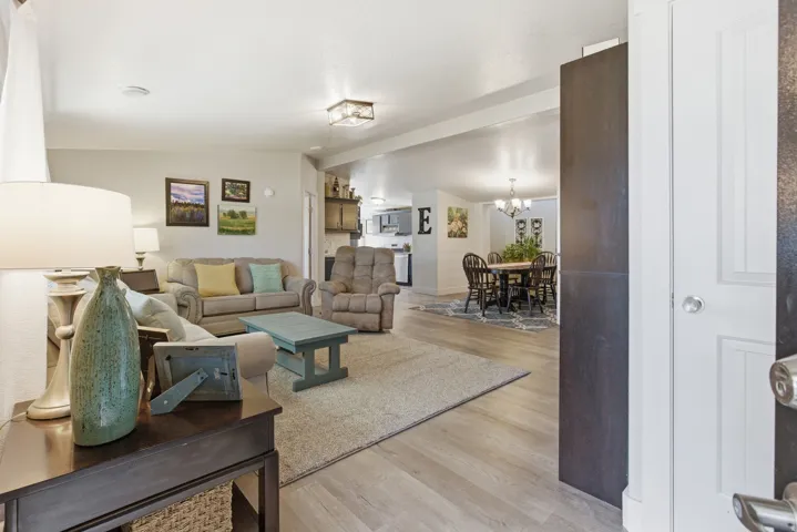 Open-concept living space featuring light wood-finish flooring