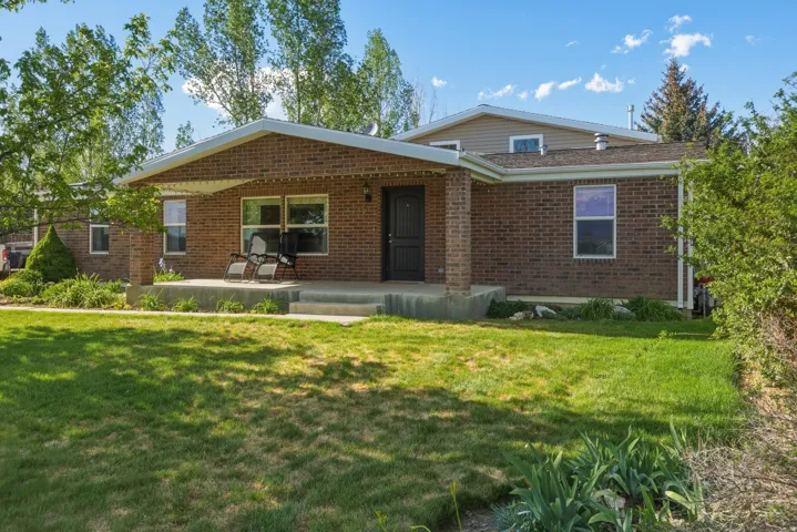 Brick exterior with a covered front porch
