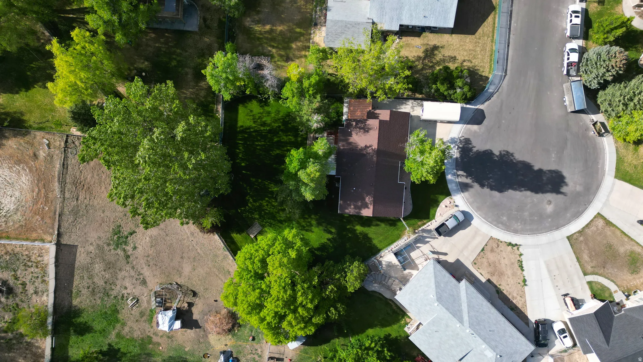 Property situated on a cul-de-sac with mature trees and a fenced rear yard