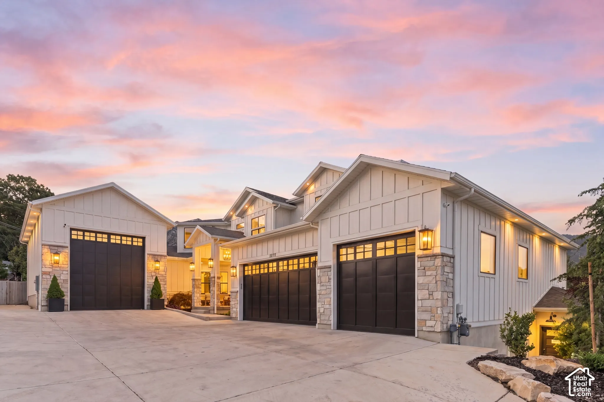 Contemporary architectural design featuring board and batten siding and stone accents
