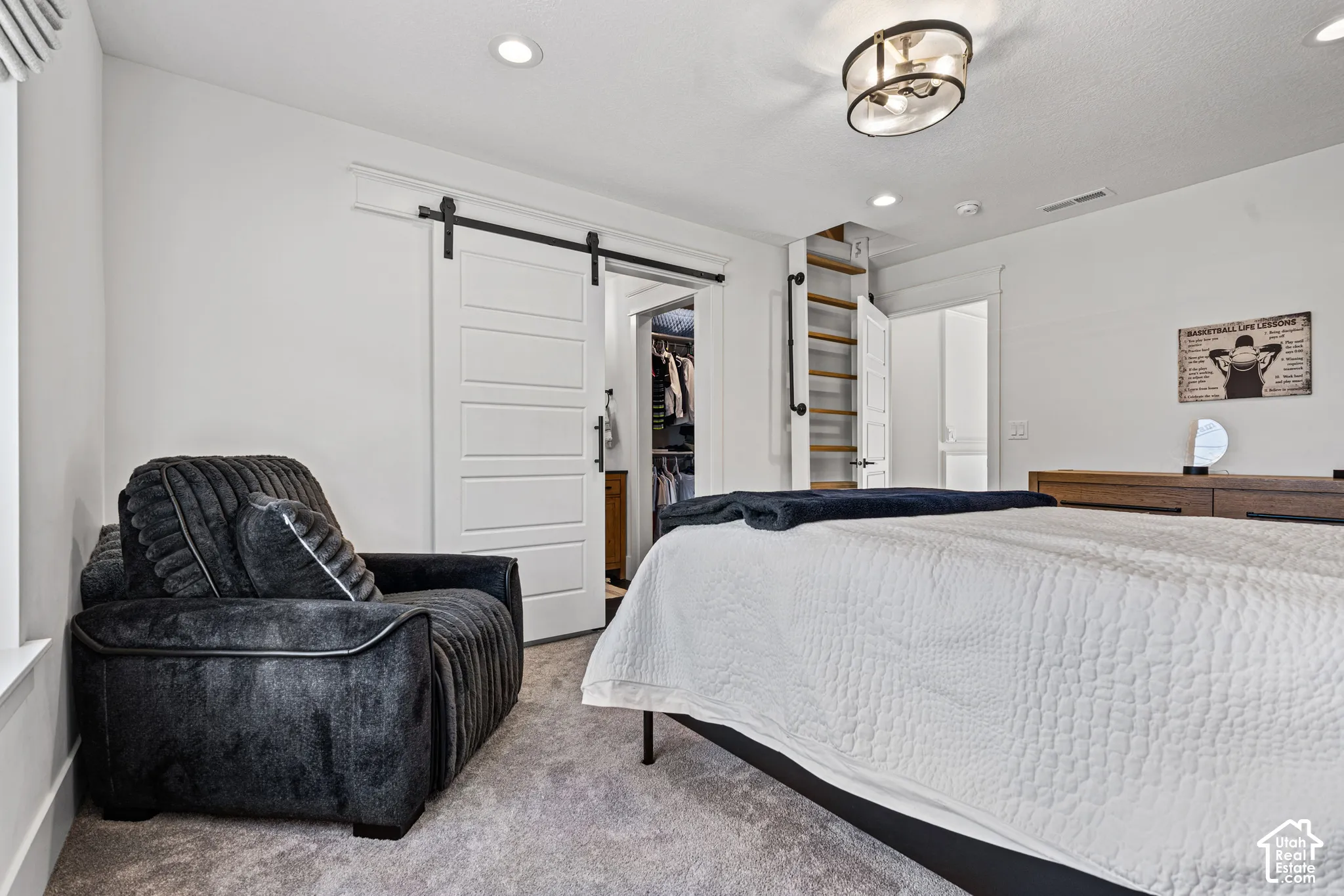 White walls and light gray carpet provide a neutral backdrop