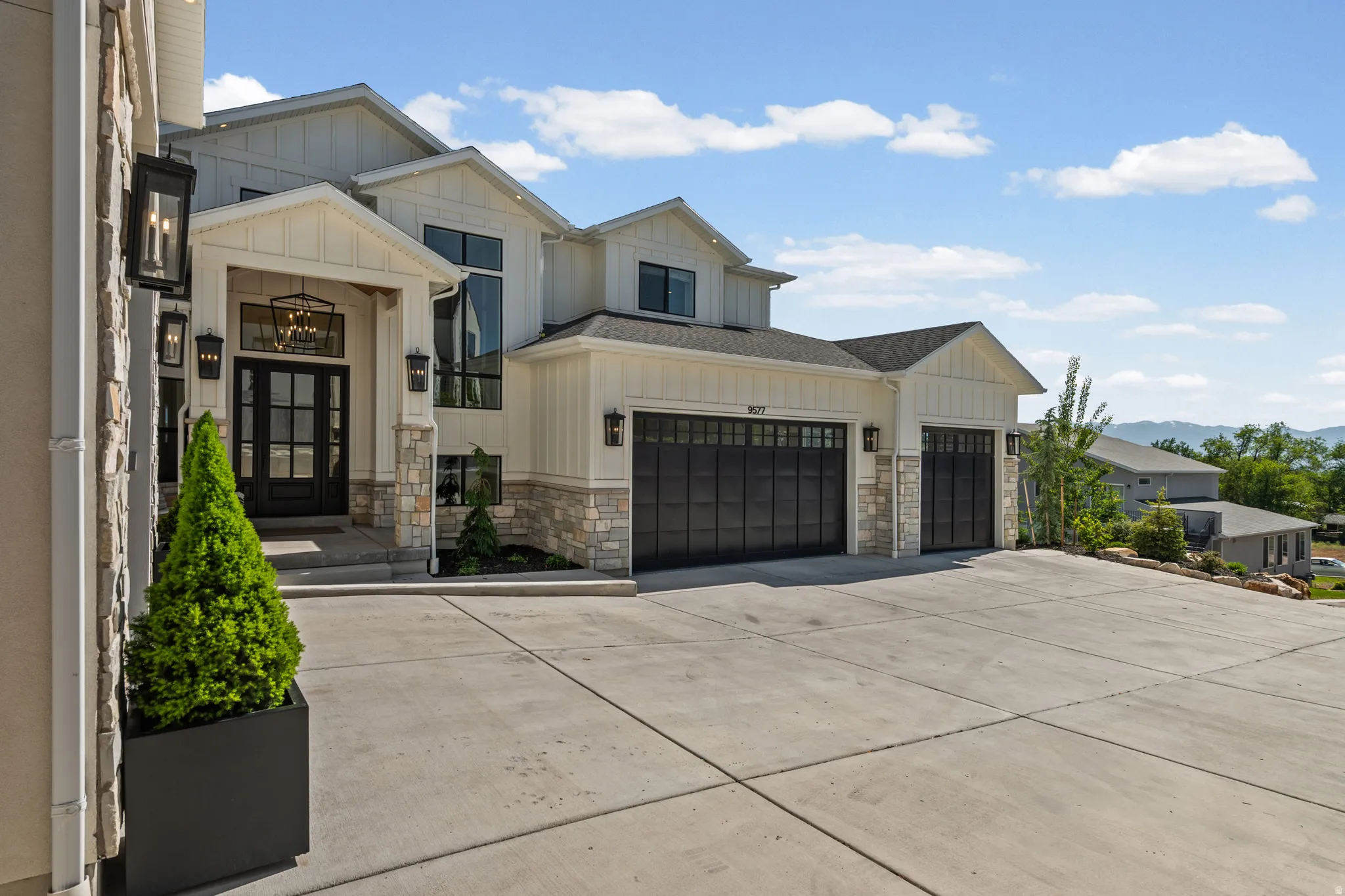 Modern farmhouse exterior with board and batten siding and stone accents