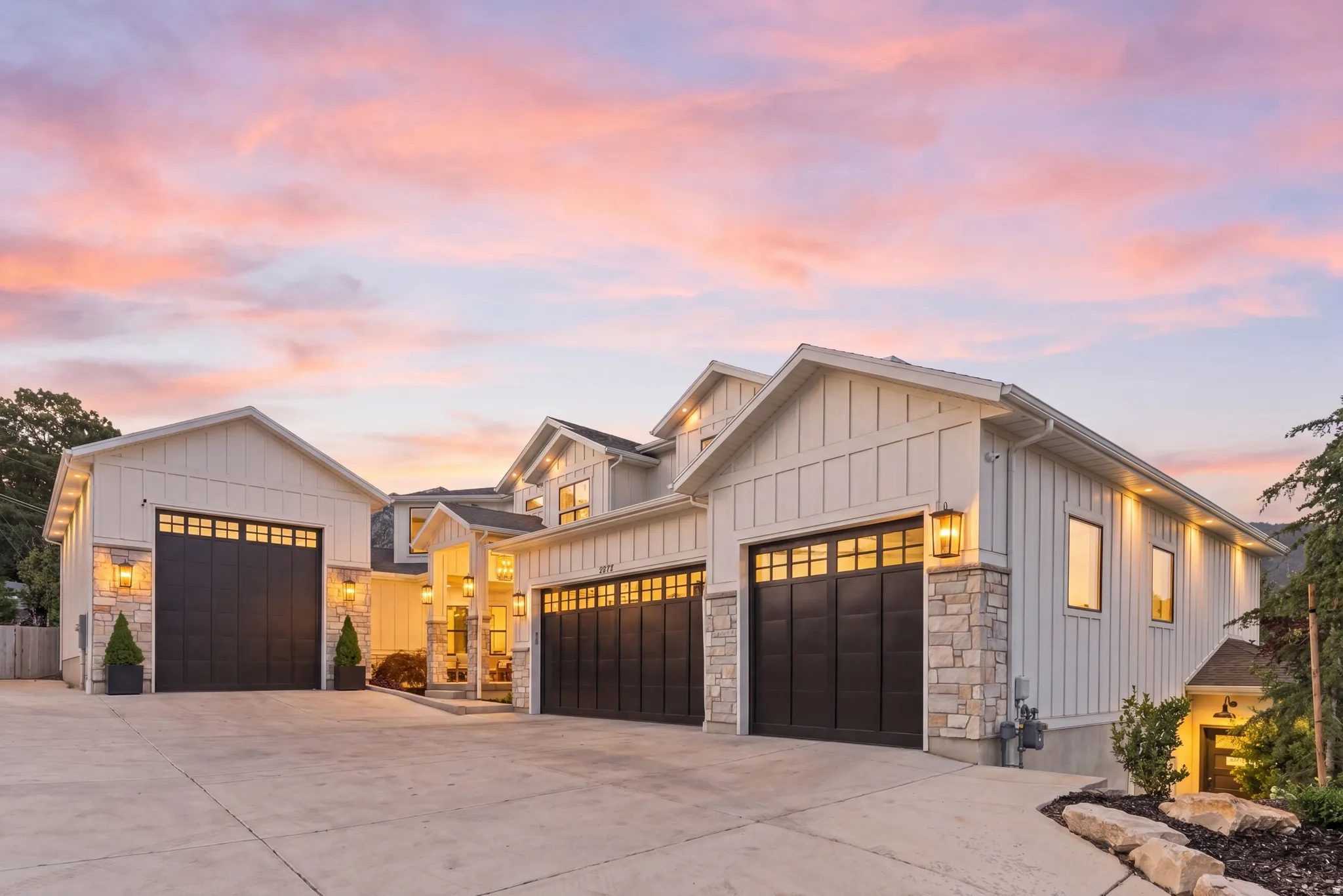 Contemporary architectural design featuring board and batten siding and stone accents