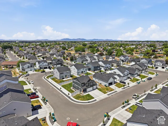 Expansive aerial showcasing a contemporary residential development with numerous single-family homes