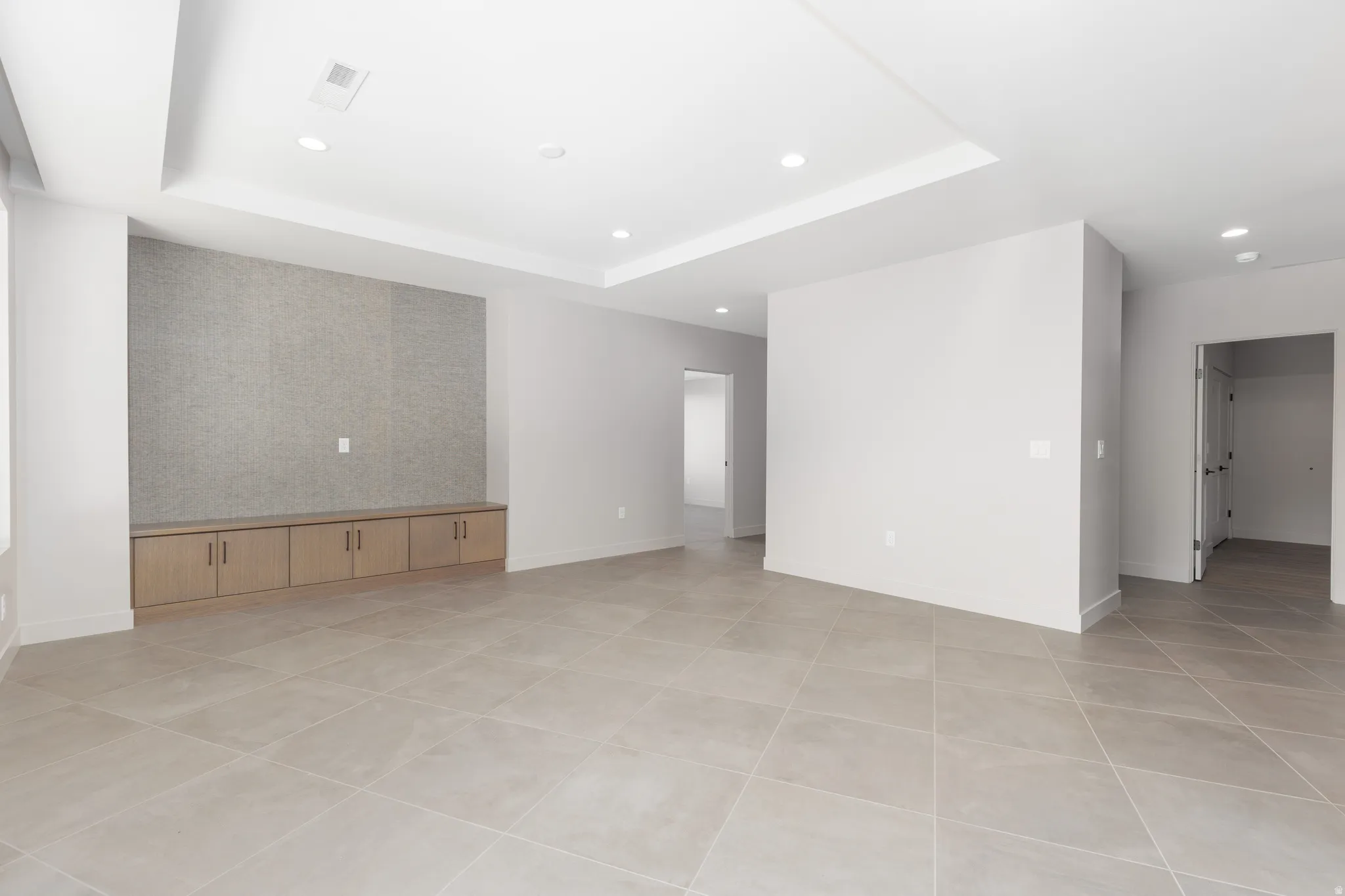 Second family room leads to 2 of the guest bedrooms.