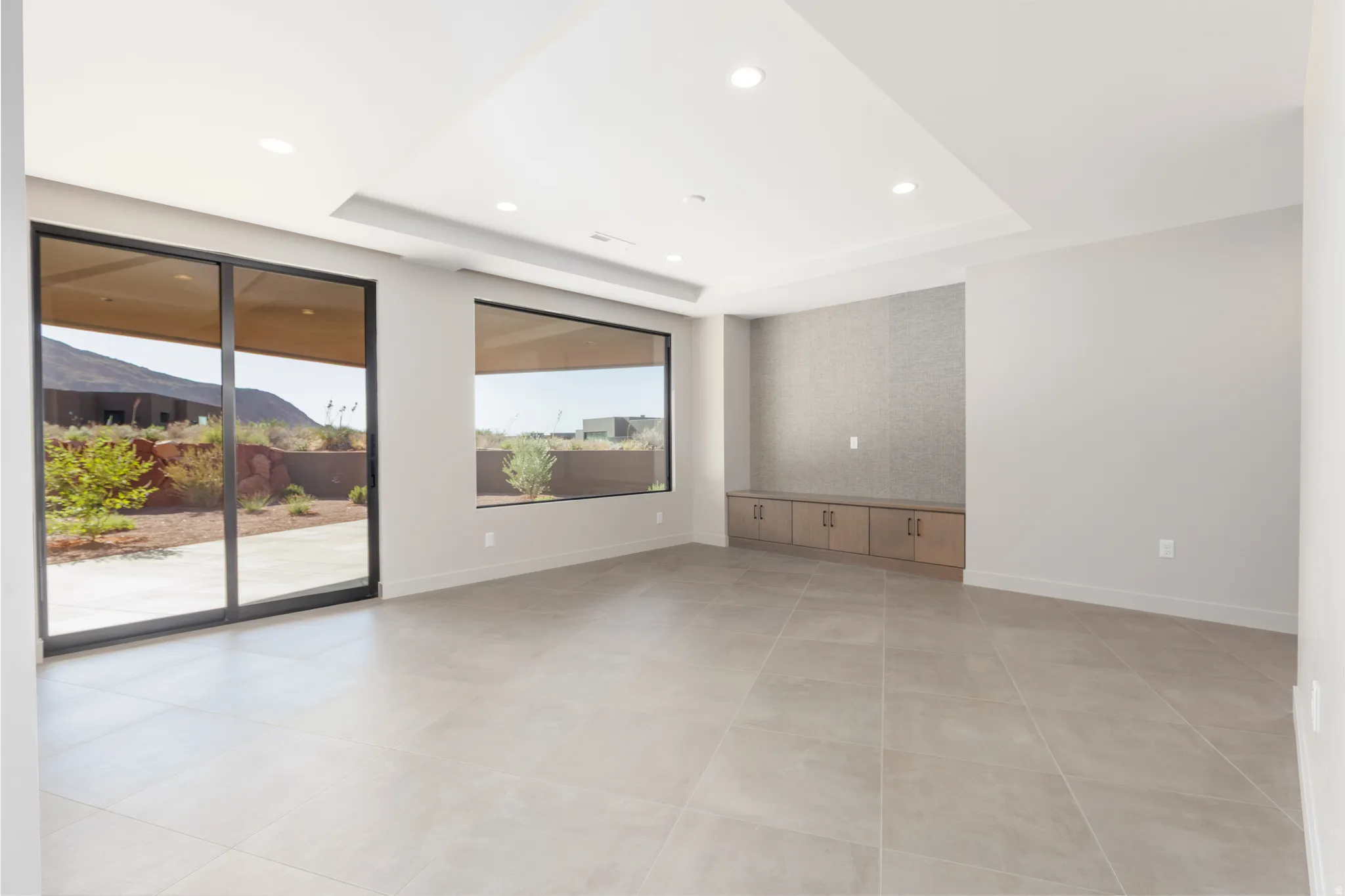 Second family room featuring a wall of windows that opens onto the large covered patio.
