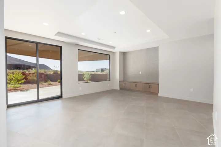 Second family room featuring a wall of windows that opens onto the large covered patio.