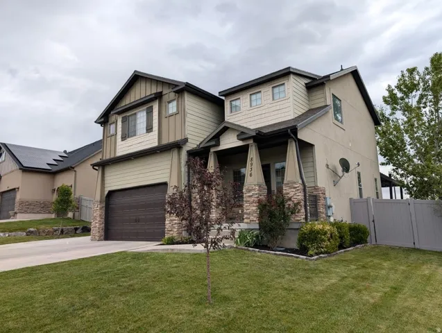 Multi-textured exterior featuring stucco, horizontal siding, and shake siding accents