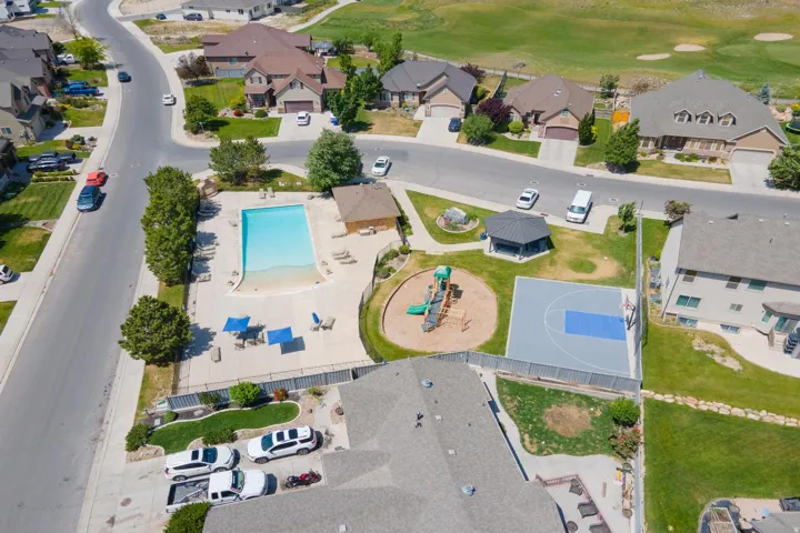 Community amenities featuring an outdoor swimming pool, playground, sports court, and covered gazebo