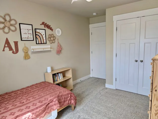 Neutral tone walls with white trim and carpeting