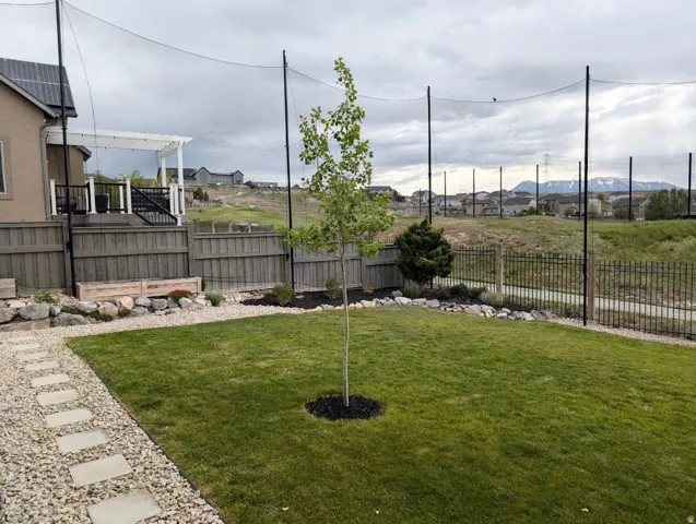 Expansive green lawn with a stepping stone path