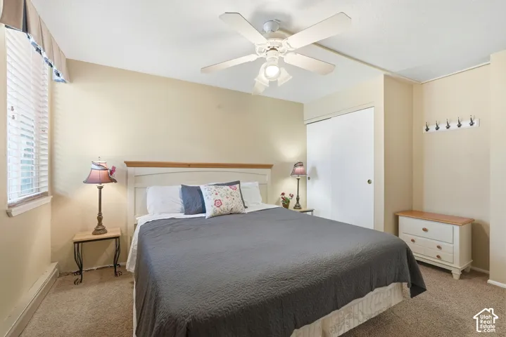 Room featuring neutral wall tones and textured carpet flooring